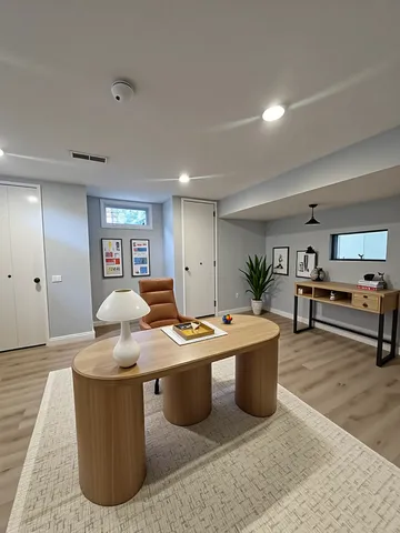 a living room with stainless steel appliances kitchen island furniture and a table