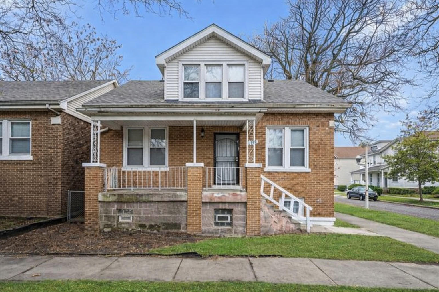 8100 South Houston Avenue Chicago, IL 60617 - Photo 1 of 55 a front view of a house with garden