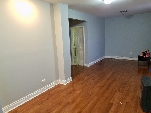 8100 South Houston Avenue Chicago, IL 60617 - Photo 34 of 55 an empty room with wooden floor and closet