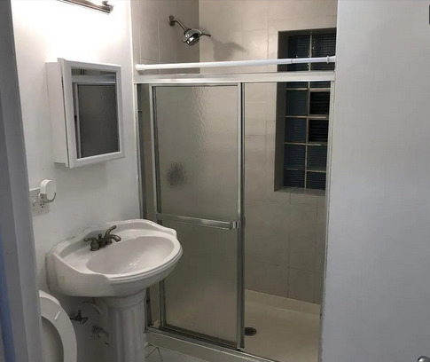 8100 South Houston Avenue Chicago, IL 60617 - Photo 37 of 55 a bathroom with a sink and a mirror