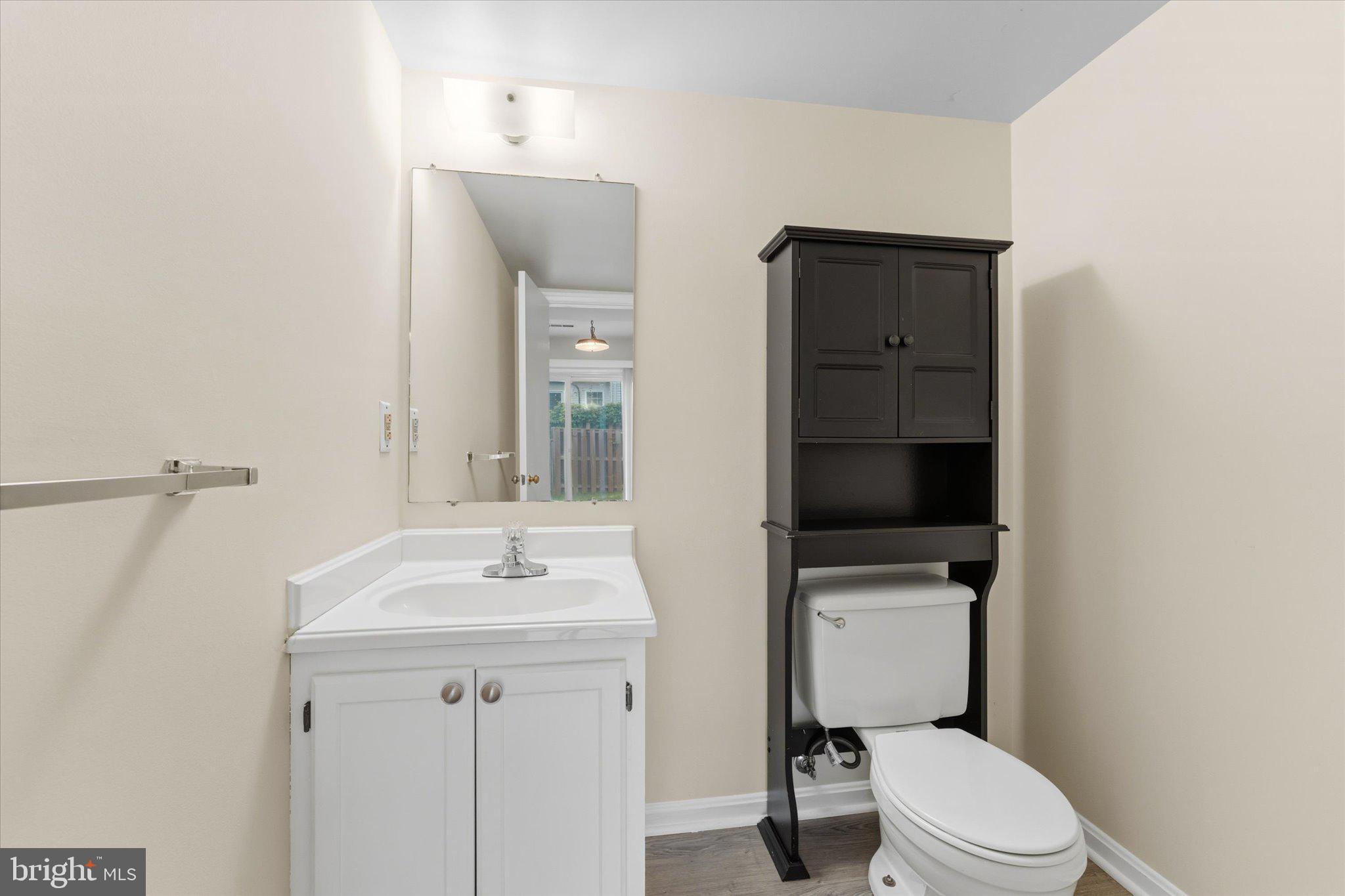 2753 Bixby Road Woodbridge, VA 22193 - Photo 6 of 22 a bathroom with a toilet a sink and mirror