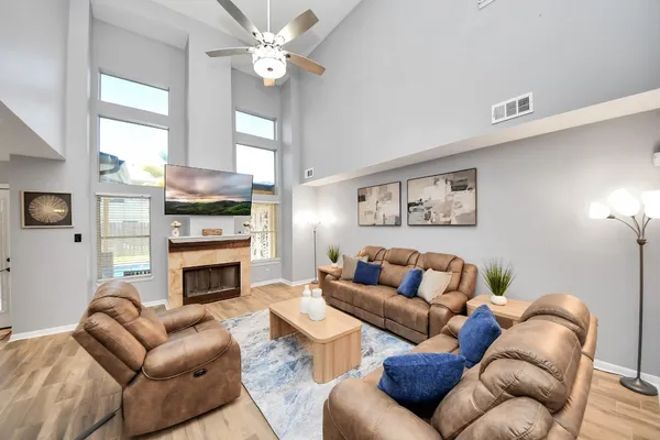 a living room with furniture a fireplace