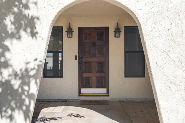 a view of a livingroom with a fireplace and window