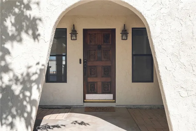 a view of a livingroom with a fireplace and window
