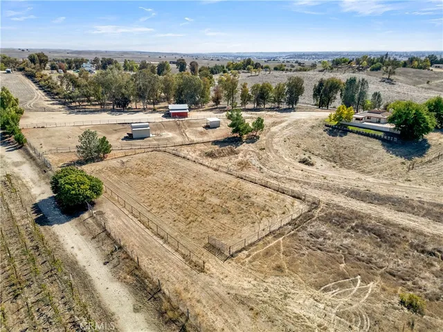 an aerial view of a house with a lake view