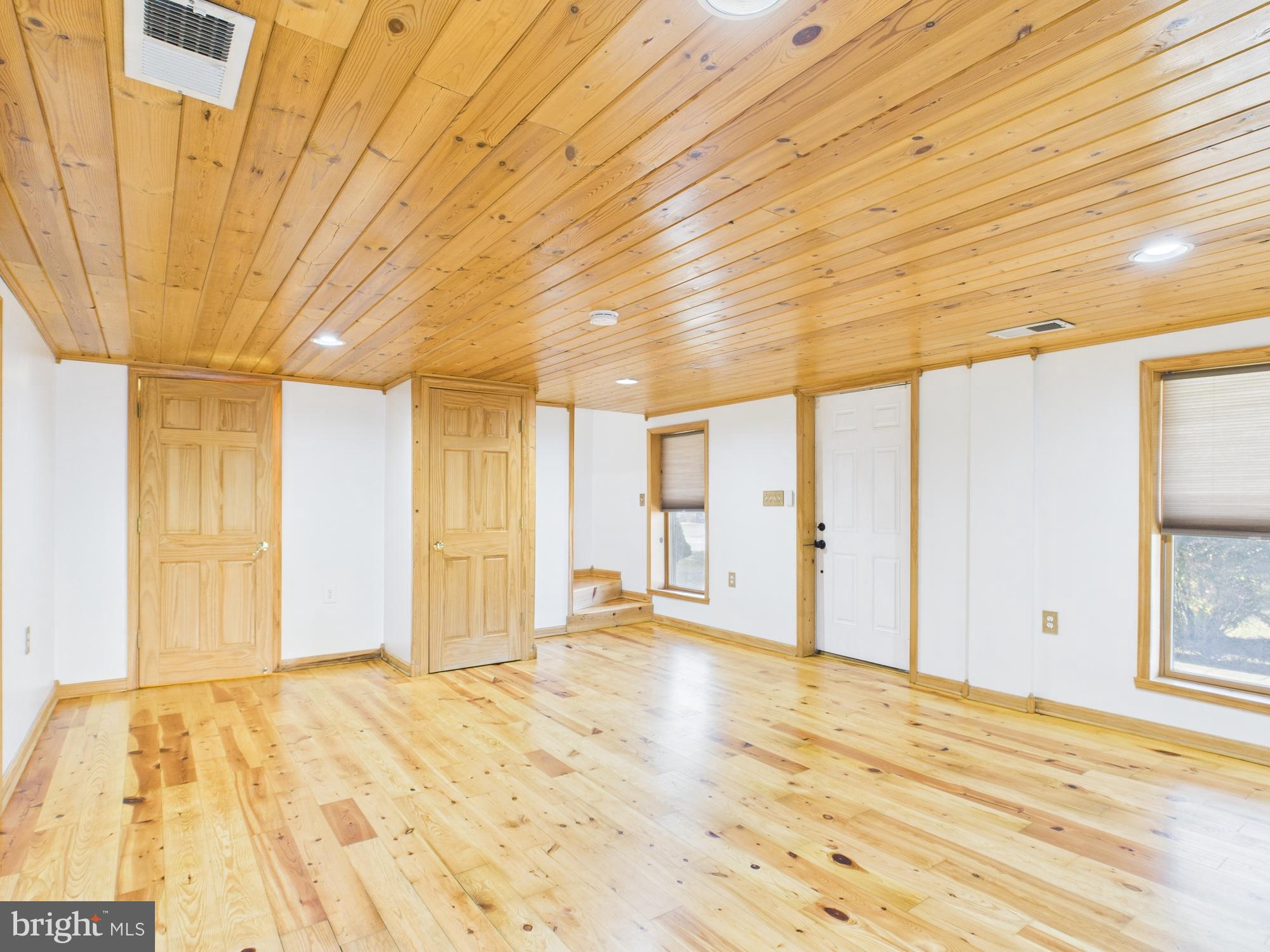 36 Runnymeade Road Bunker Hill, WV 25413 - Photo 15 of 45 Spacious room with warm wooden accents.