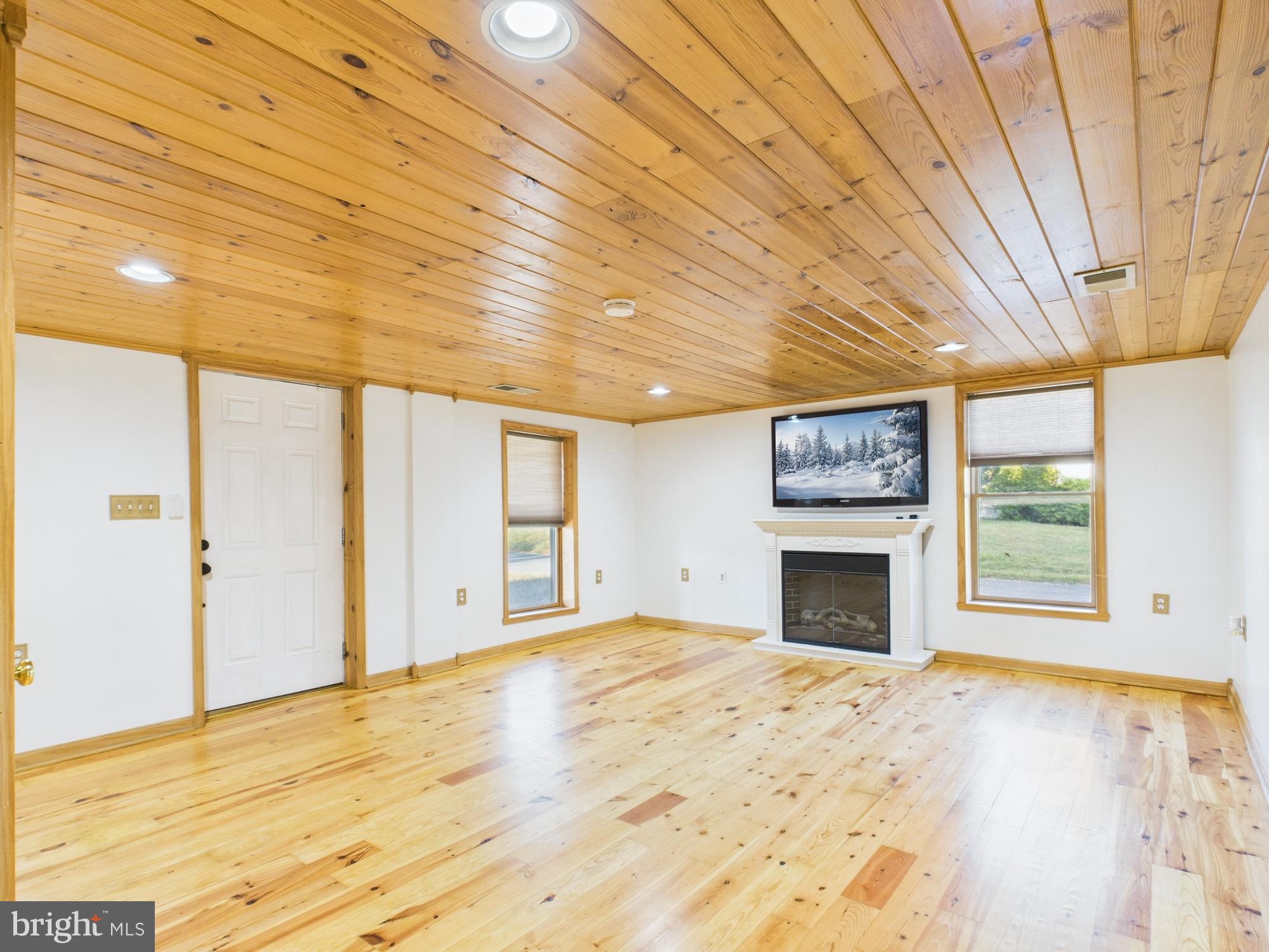 36 Runnymeade Road Bunker Hill, WV 25413 - Photo 16 of 45 Spacious room with warm wooden accents.
