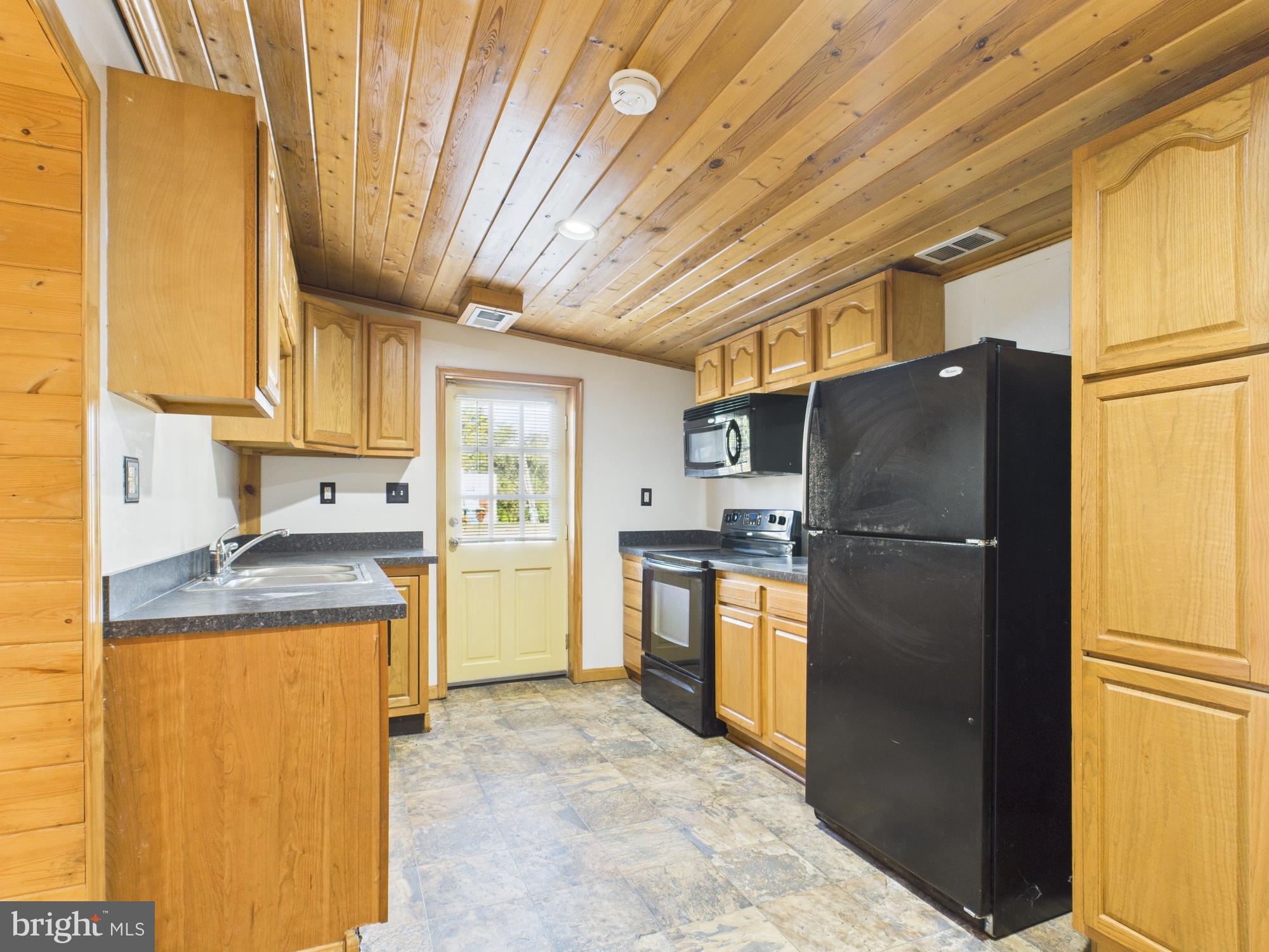 36 Runnymeade Road Bunker Hill, WV 25413 - Photo 20 of 45 Charming kitchen with rustic wood accents.