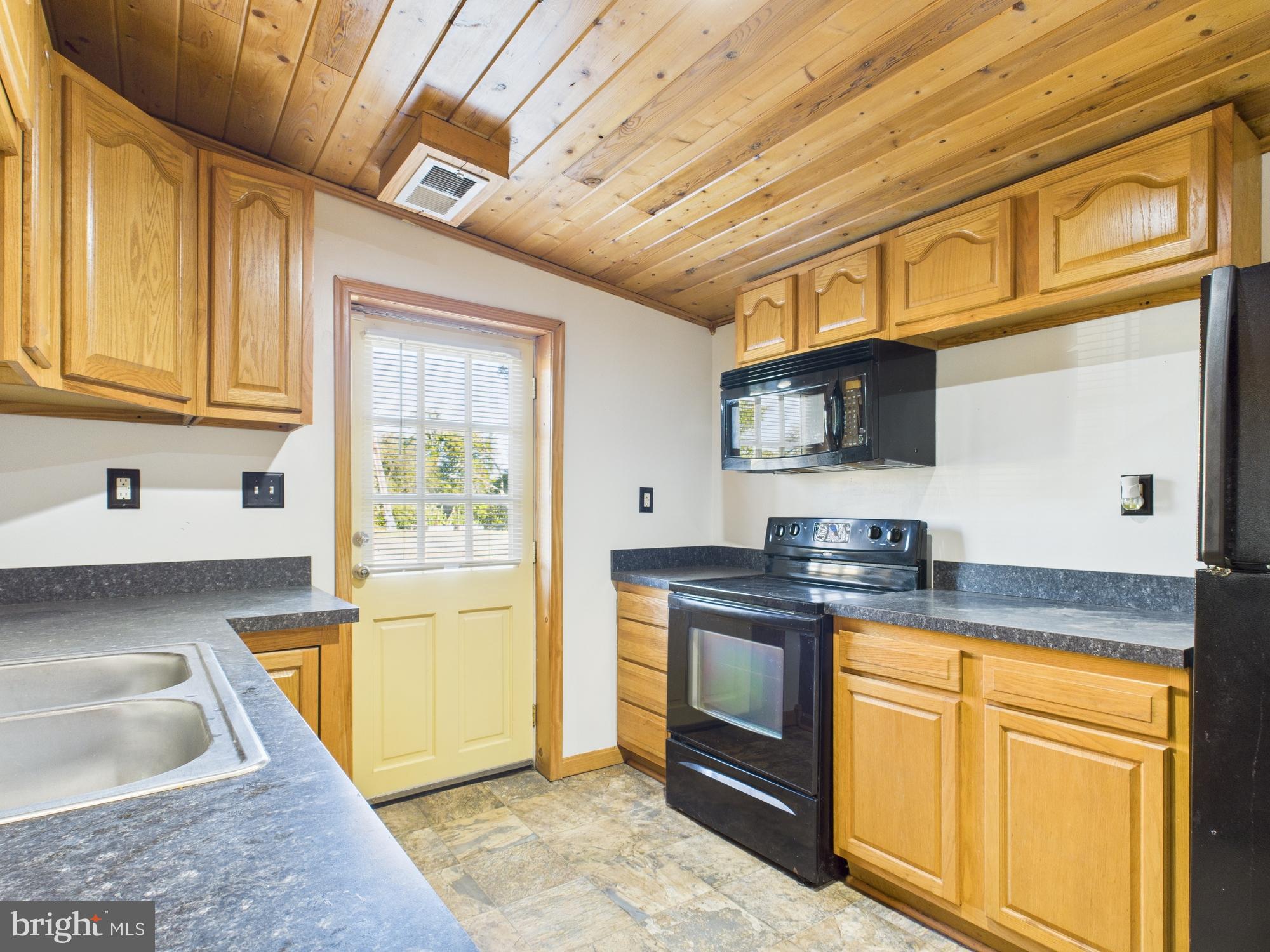 36 Runnymeade Road Bunker Hill, WV 25413 - Photo 22 of 45 Charming kitchen with rustic wood accents.