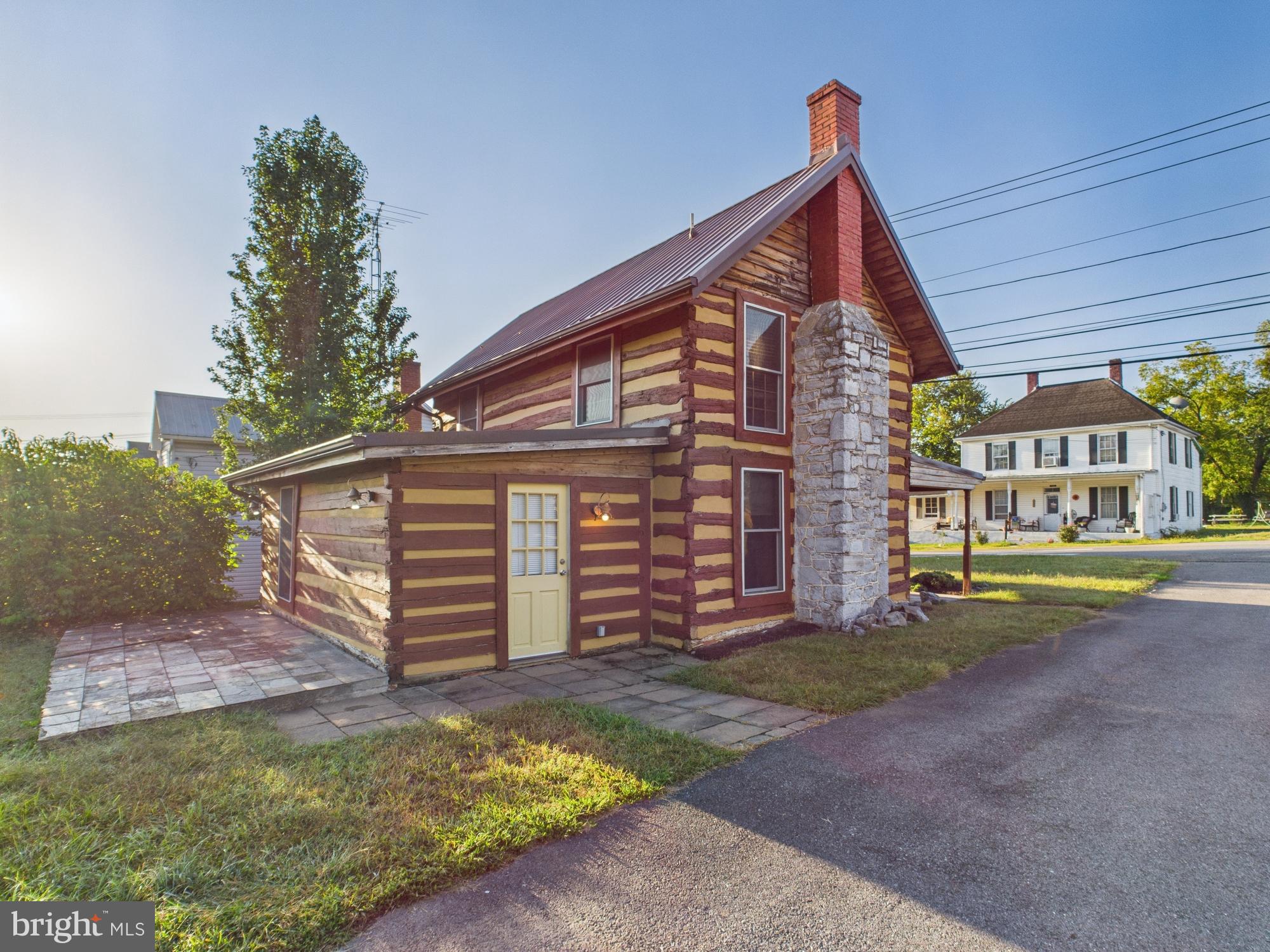 36 Runnymeade Road Bunker Hill, WV 25413 - Photo 9 of 45 Charming log cabin with rustic appeal.