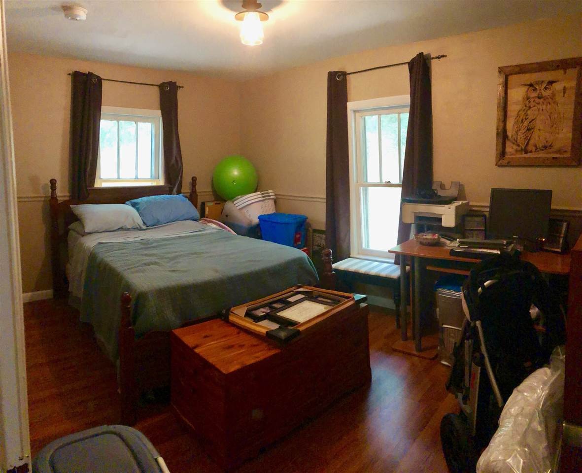 2000 Old River Road Charleston, TN 37310 - Photo 5 of 9 a bedroom with a bed and wooden floor