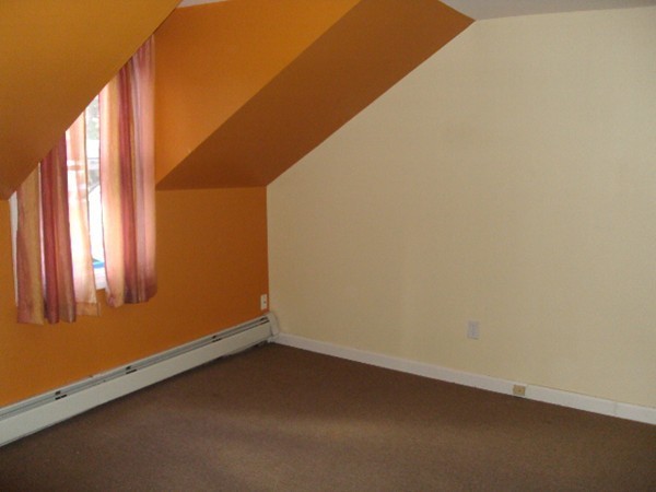 126 Ridge Street Fall River, MA 02721 - Photo 15 of 28 a view of an empty room with a window