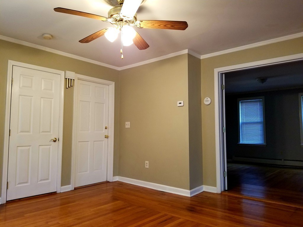 126 Ridge Street Fall River, MA 02721 - Photo 3 of 28 a view of an empty room with wooden floor