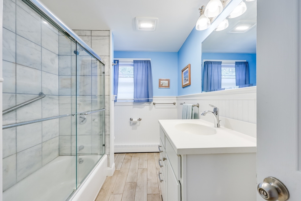 80 Sterling Road Barnstable, MA 02601 - Photo 14 of 19 a bathroom with a sink a mirror and a bathtub