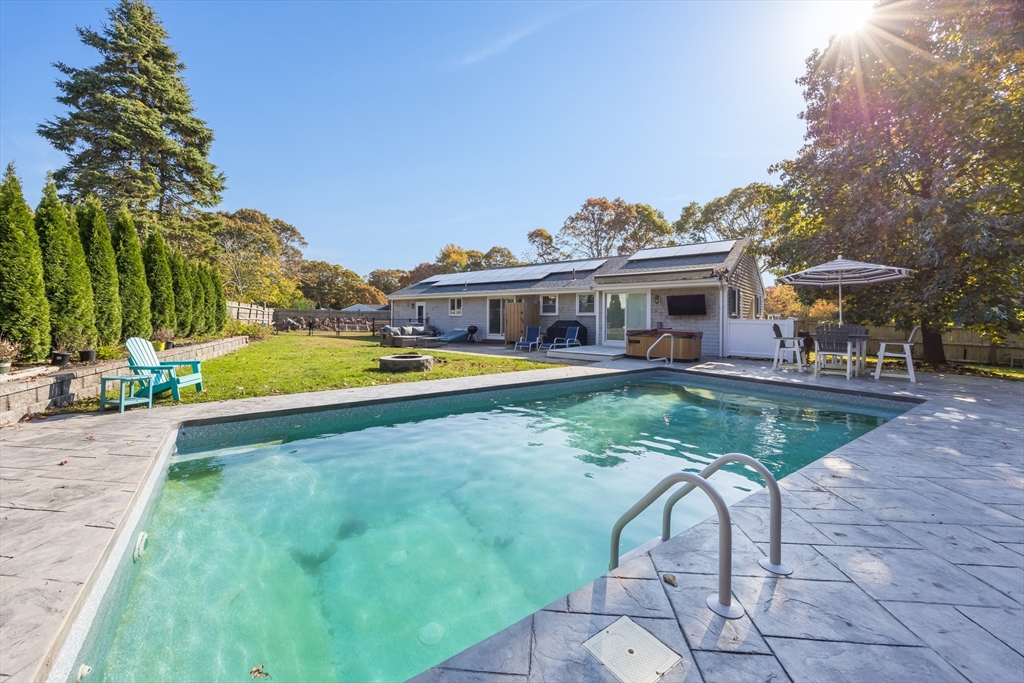 80 Sterling Road Barnstable, MA 02601 - Photo 15 of 19 a view of a swimming pool with a patio and a yard