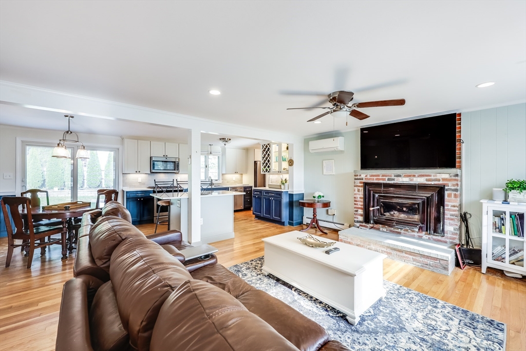 80 Sterling Road Barnstable, MA 02601 - Photo 5 of 19 a living room with fireplace furniture and a flat screen tv