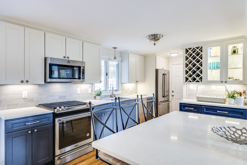 80 Sterling Road Barnstable, MA 02601 - Photo 8 of 19 a kitchen with stainless steel appliances a stove a sink dishwasher a refrigerator and a microwave
