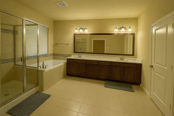 a bathroom with a tub a sink and a mirror