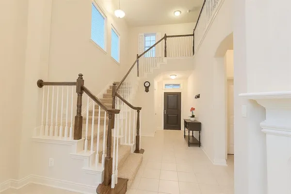a view of entryway with stairs and a livingroom