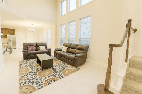 a living room with furniture or couch and a potted plant