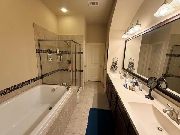 a bathroom with a bathtub and a sink