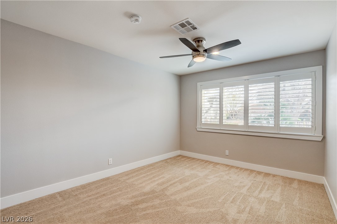4207 Ridgecrest Drive Las Vegas, NV 89121 - Photo 19 of 27 Bedroom featuring light carpet and ceiling fan
