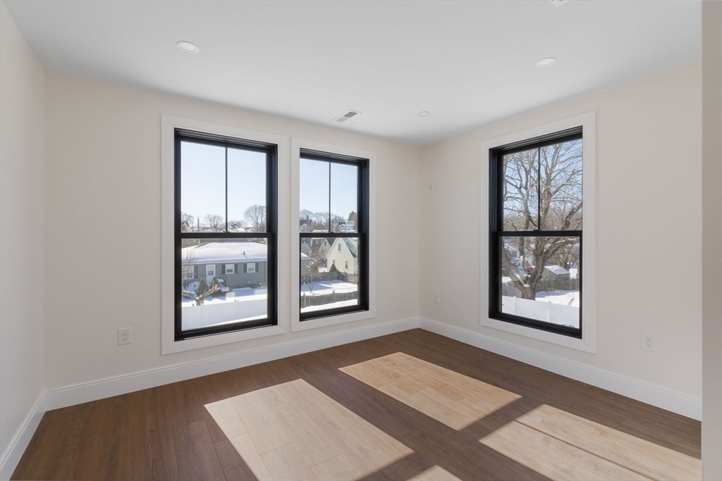 1864 River Street Boston, MA 02136 - Photo 20 of 38 a view of an empty room with a window