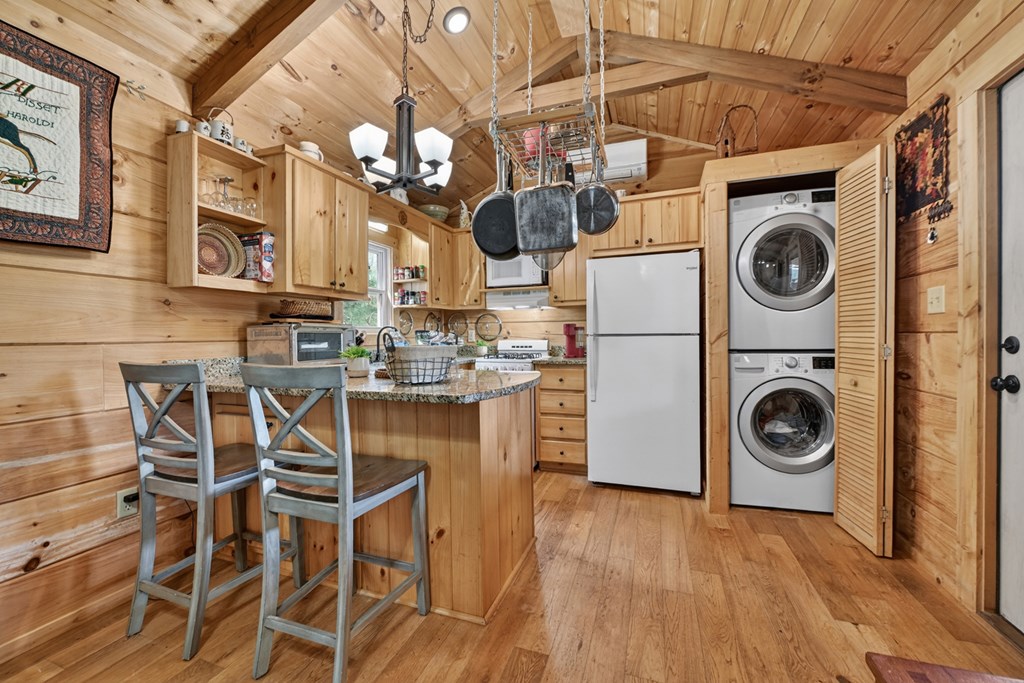 57 Meadow Hill Morganton, GA 30560 - Photo 17 of 59 a view of a kitchen with stainless steel appliances granite countertop a wooden floor and cabinets