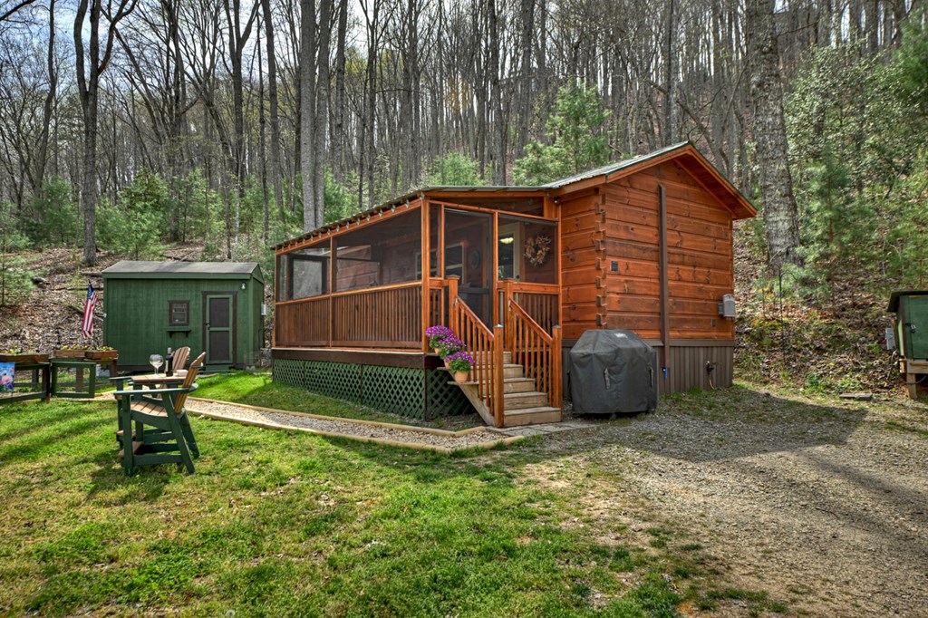 57 Meadow Hill Morganton, GA 30560 - Photo 37 of 59 a view of backyard with a table and chairs