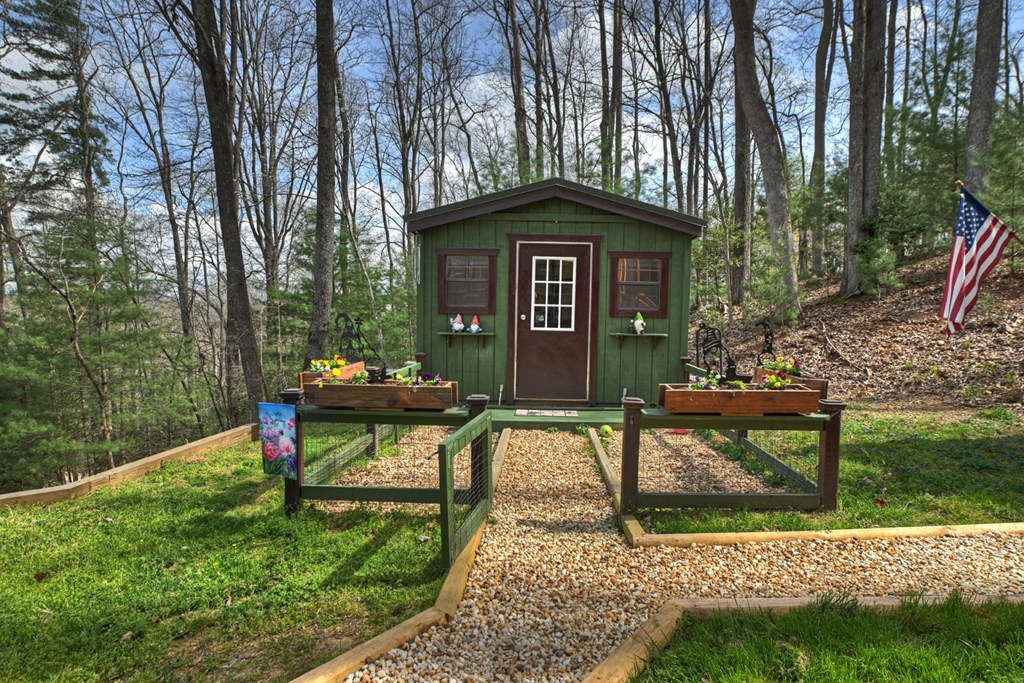 57 Meadow Hill Morganton, GA 30560 - Photo 40 of 59 a view of a bench in the garden near a trees