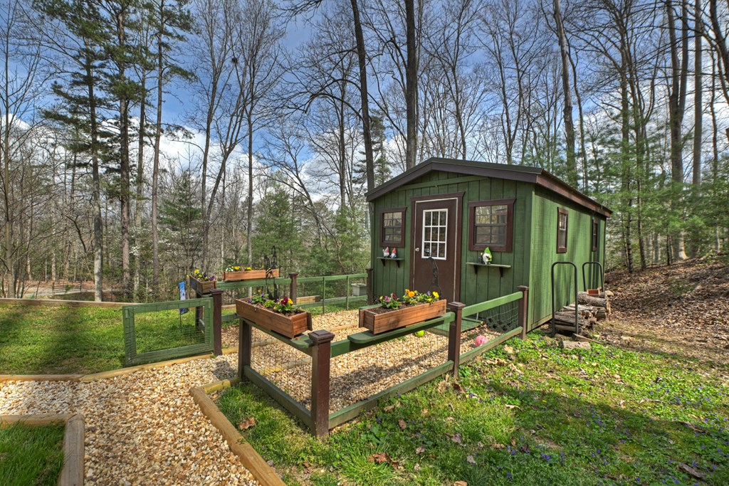 57 Meadow Hill Morganton, GA 30560 - Photo 42 of 59 a front view of a house with garden