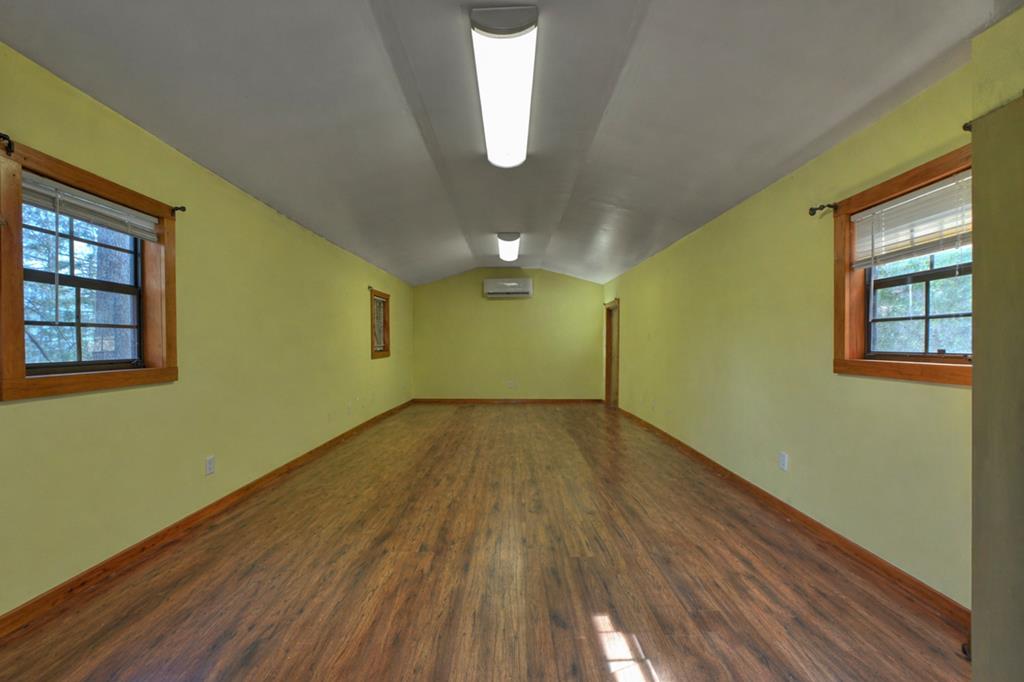 57 Meadow Hill Morganton, GA 30560 - Photo 49 of 59 an empty room with wooden floor and windows