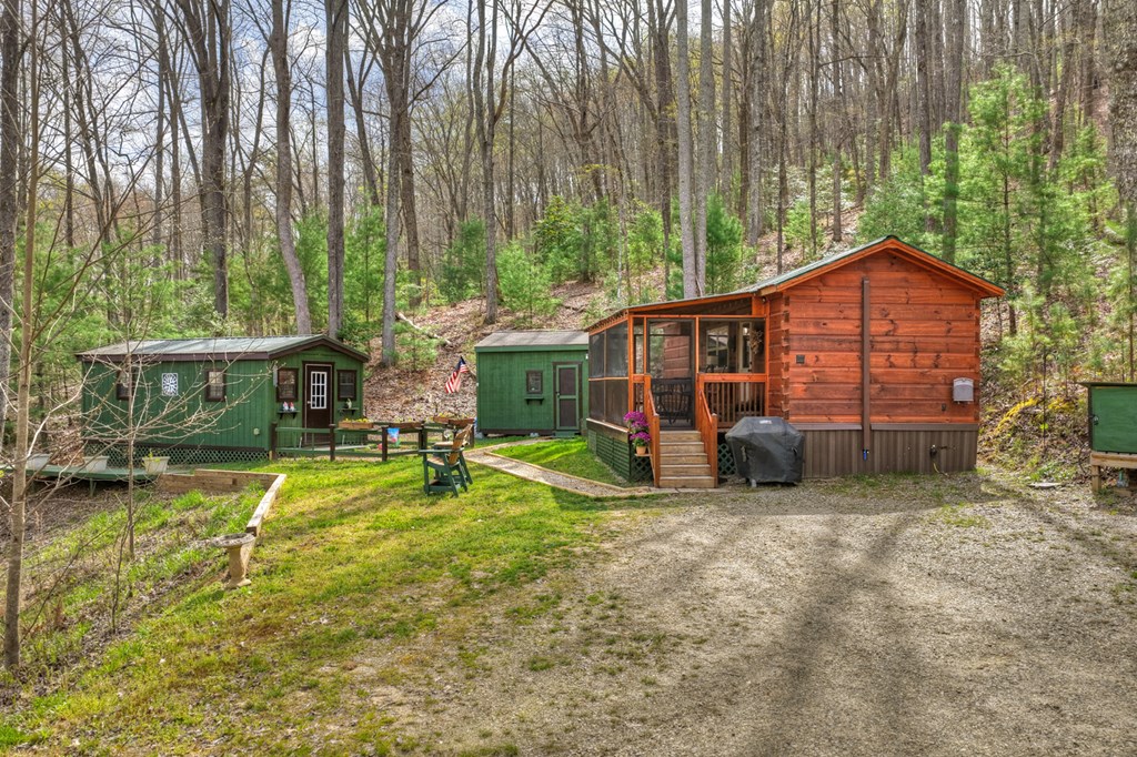 57 Meadow Hill Morganton, GA 30560 - Photo 10 of 59 a view of a house with backyard porch and sitting area
