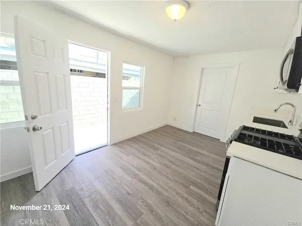 a view of a kitchen from the hallway
