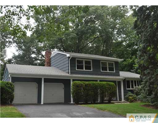 25 Hillwood Road East Brunswick, NJ 08816 - Photo 1 of 9 a front view of a house with a garden
