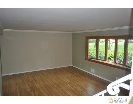 25 Hillwood Road East Brunswick, NJ 08816 - Photo 2 of 9 a view of an empty room with a window