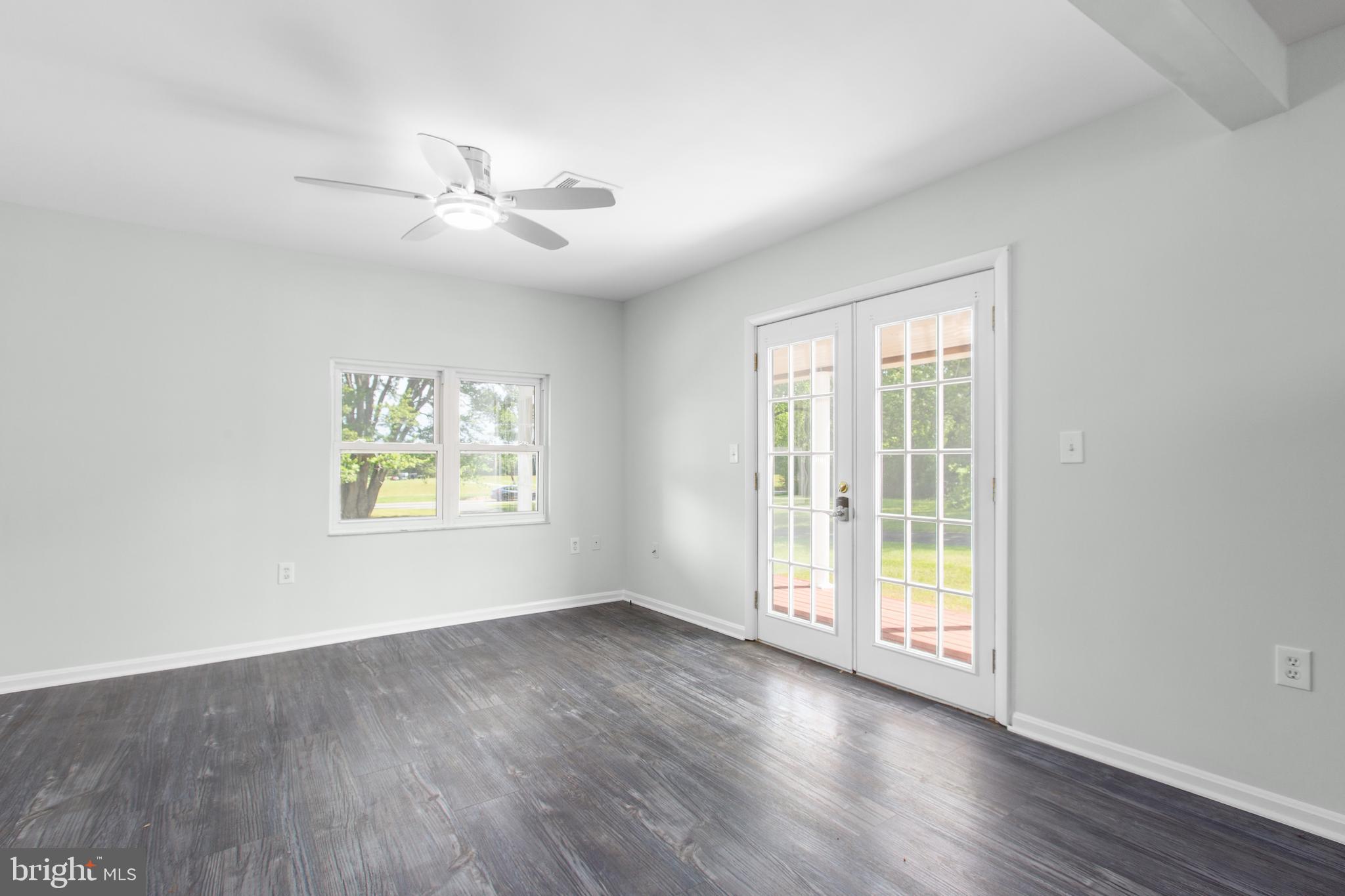 10827 Catharpin Road Spotsylvania, VA 22553 - Photo 19 of 39 wooden floor in an empty room with a window