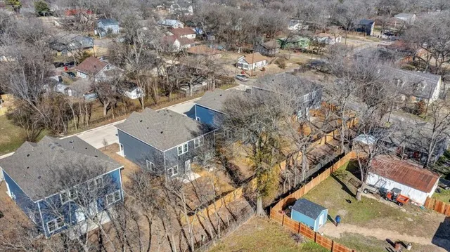 a view of roof with yard and mountain view in back