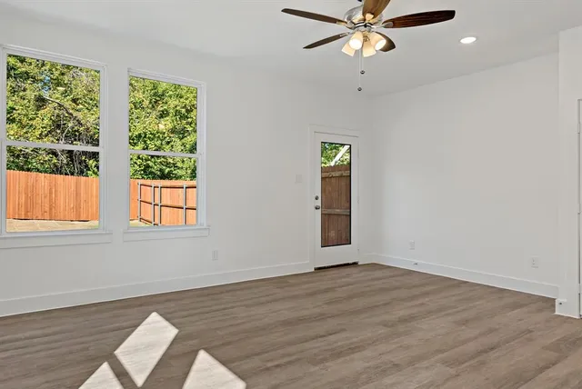 a view of an entryway with wooden floor