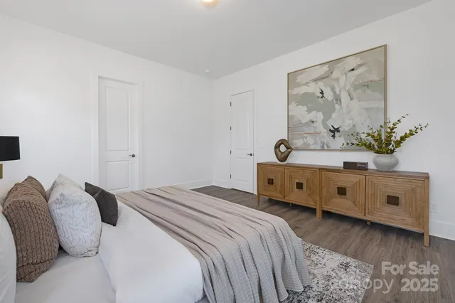 a view of a livingroom with furniture and a mirror