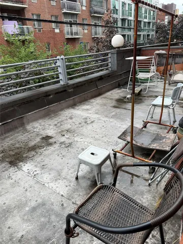 a view of a backyard with sitting area