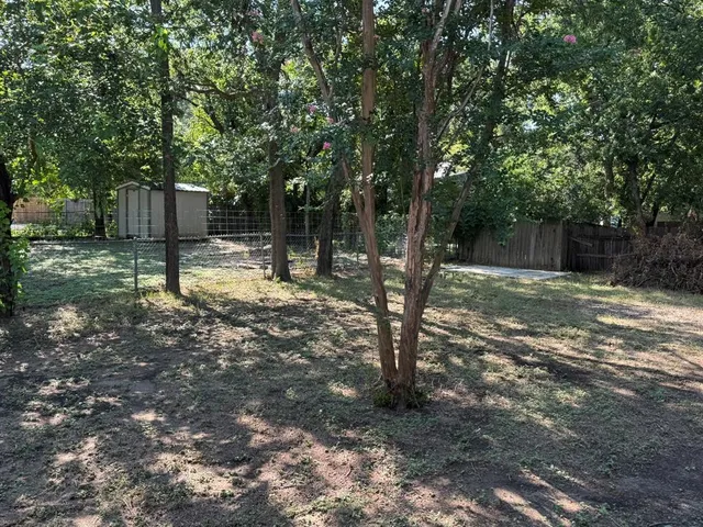 a backyard of a house with lots of green space