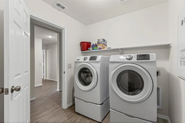 a utility room with dryer and washer