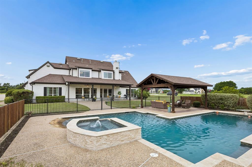 1700 Rock Ridge Road Lucas, TX 75002 - Photo 31 of 37 A fence has been added on the north and south sides of the pool for privacy!