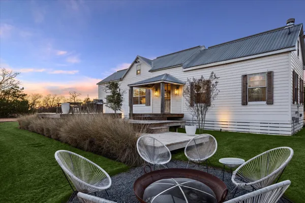 a backyard of a house with seating space