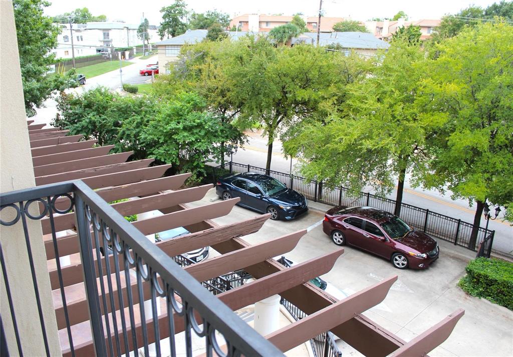 3102 Kings Road, Unit 1207 Dallas, TX 75219 - Photo 13 of 13 a view of a patio with table and chairs and potted plants
