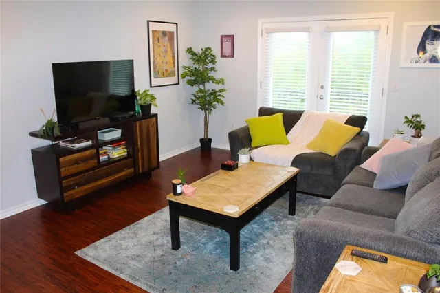 a kitchen with a table chairs and refrigerator