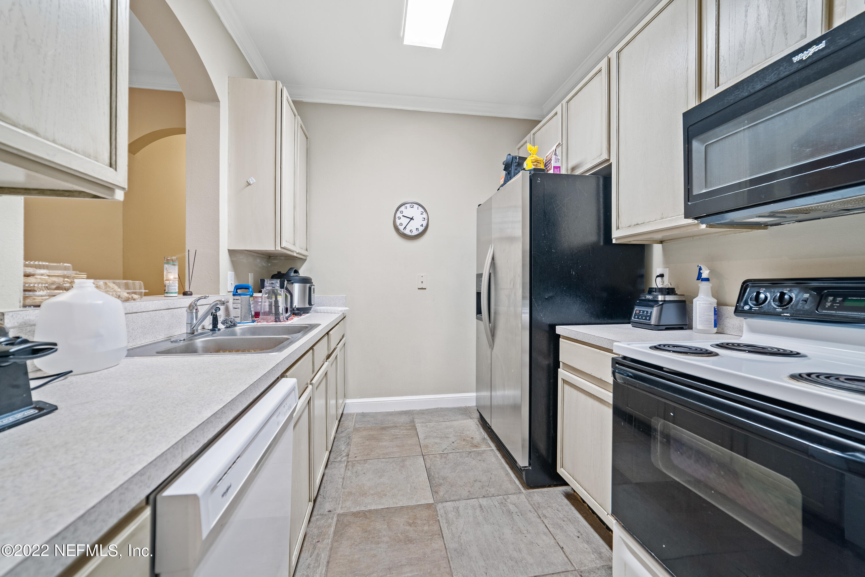 10550 Baymeadows Road, Unit 624 Jacksonville, FL 32256 - Photo 4 of 21 a kitchen with stainless steel appliances granite countertop a sink stove and refrigerator