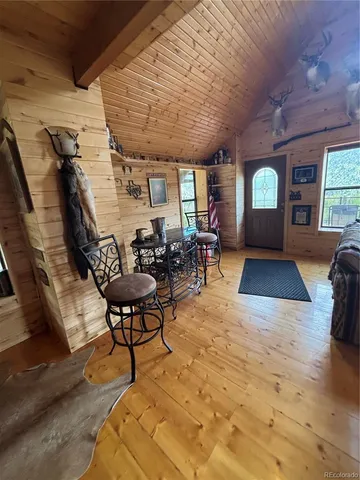 a view of an entryway and livingroom