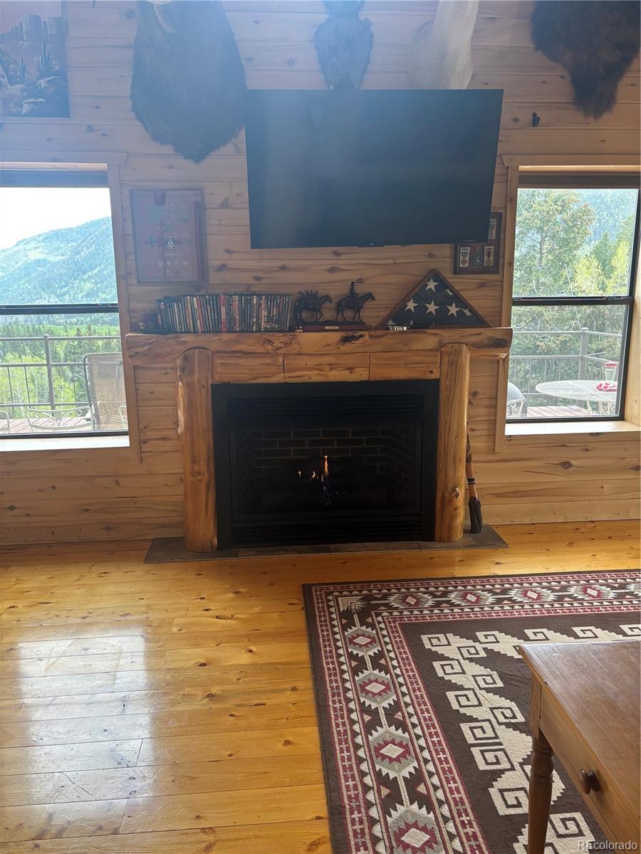 1113 Spring Street Del Norte, CO 81132 - Photo 24 of 45 an empty room with a fireplace